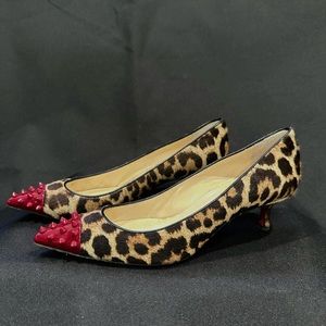 Christian Louboutin Leopard Pony Hair & Spike Patent Toe Pumps.
